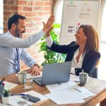 Team Business - man in white dress shirt sitting beside woman in black long sleeve shirt