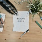 Marketing - white printing paper with Marketing Strategy text