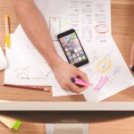 Marketing - person writing on white paper