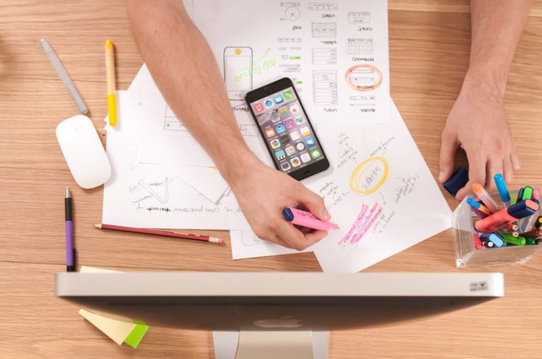 Marketing - person writing on white paper