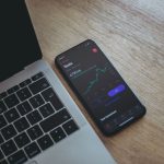 Investing - black android smartphone on macbook pro