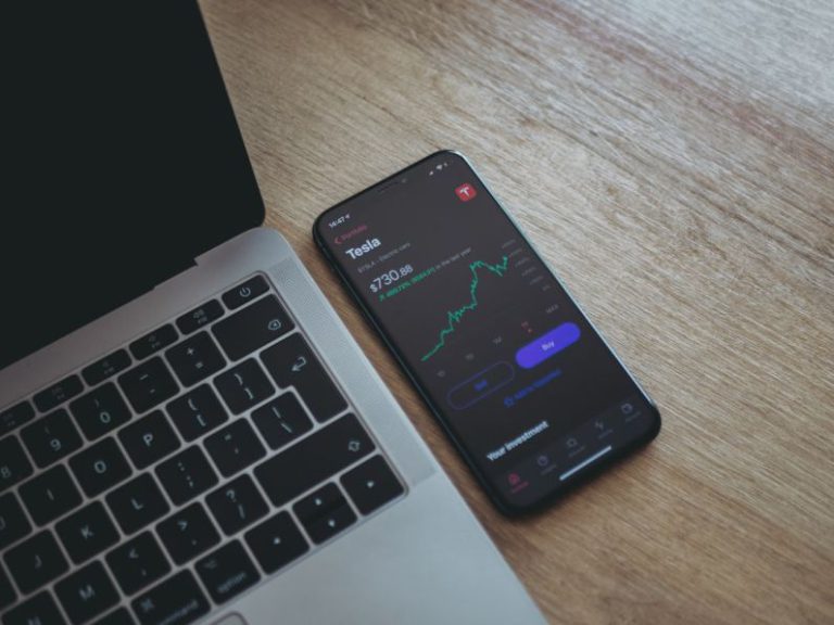Investing - black android smartphone on macbook pro