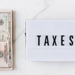 Monetary Policy - American dollar bills and vintage light box with inscription