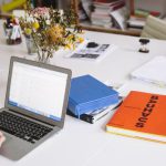 HR - Photo Of Orange Book Beside Laptop