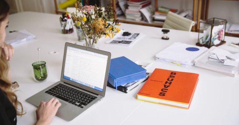 HR - Photo Of Orange Book Beside Laptop