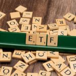 Asset Allocation - The word etf on a wooden board with scrabble tiles