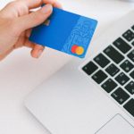 E-commerce Presence - Person Holding Bank Card