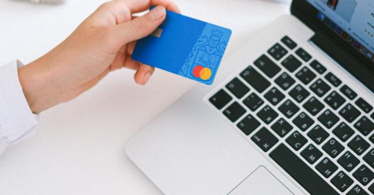 E-commerce Presence - Person Holding Bank Card