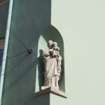 Niche Markets - White Statue of a Man on a Window