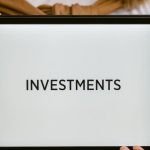 Safe-Haven Investments - Close-Up Shot of a Person Holding a Tablet