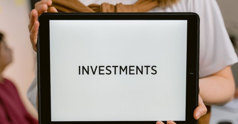 Safe-Haven Investments - Close-Up Shot of a Person Holding a Tablet
