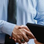 Time-Management Solutions - Entrepreneurs shaking hands after agreement