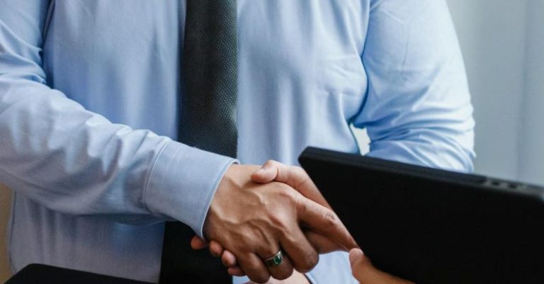 Time-Management Solutions - Entrepreneurs shaking hands after agreement
