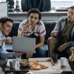 Start-up - Start-Up Team Discussing a Project over a Pizza