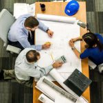 Project Management Tools - Three People Sitting Beside Table