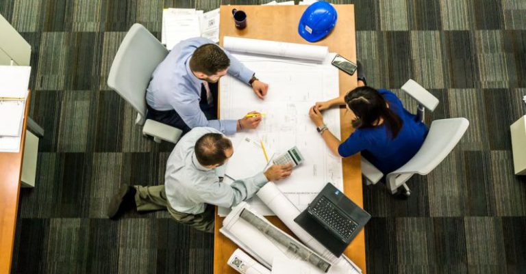 Project Management Tools - Three People Sitting Beside Table