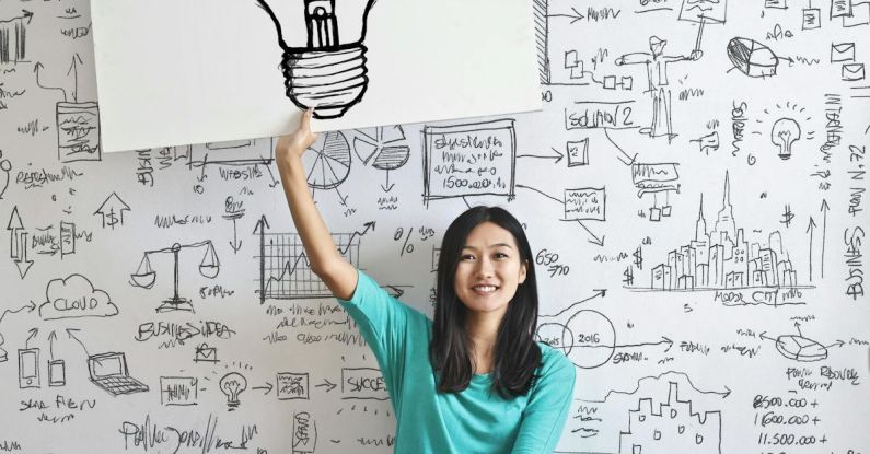 Intelligence - Woman Draw a Light bulb in White Board