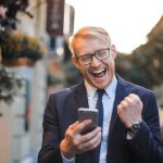 Mobile Commerce - Man in Black Suit Jacket Received A Good News