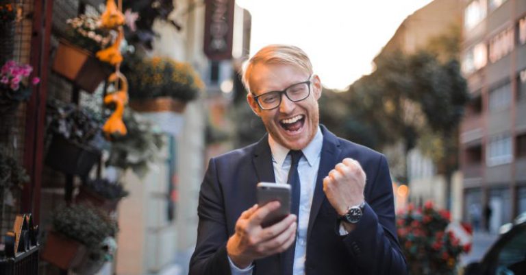Mobile Commerce - Man in Black Suit Jacket Received A Good News