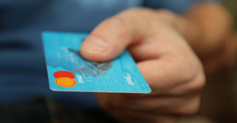 Credit - Person Holding Debit Card
