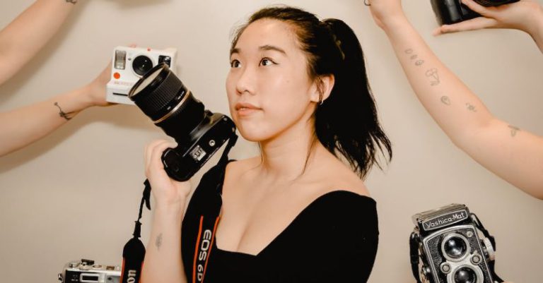 Creative Problem Solving - Asian woman with photo camera in hand